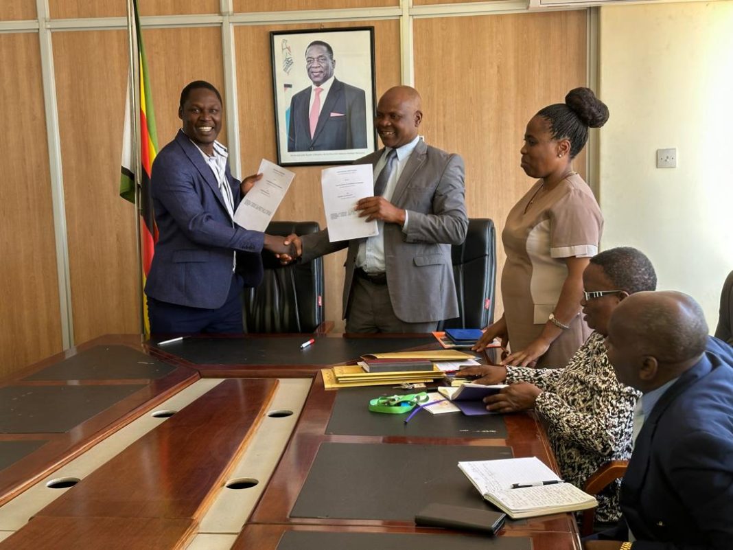 Officials exchange signed MOUs and shake hands at Zimbabwe’s Ministry of Primary and Secondary Education in Harare.