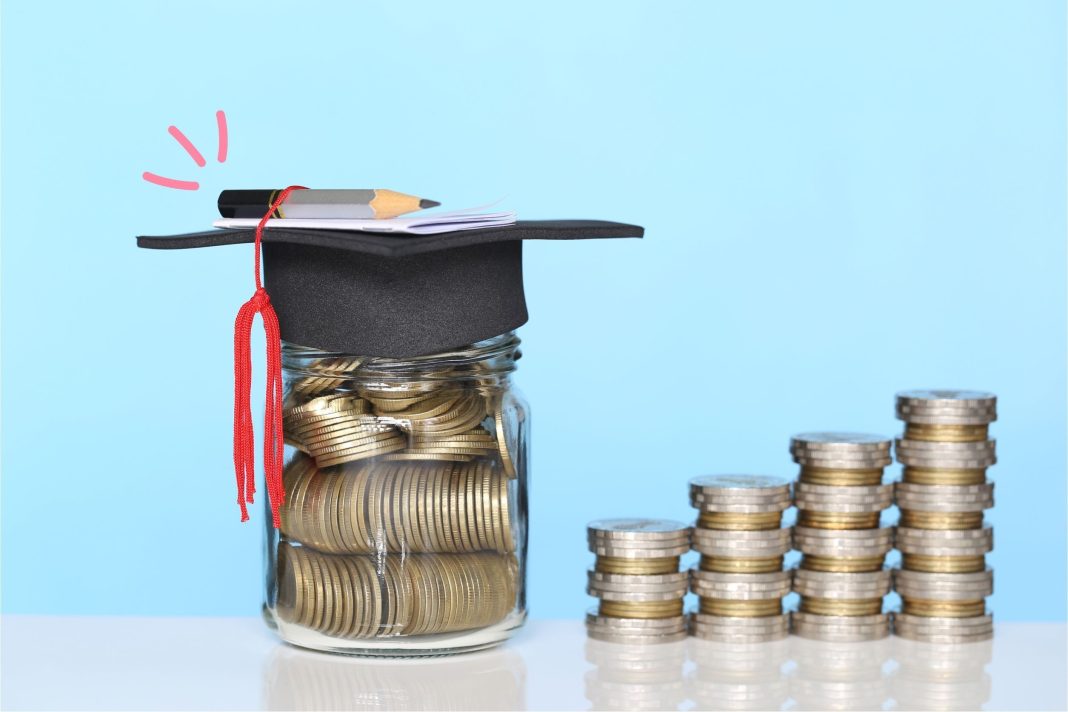Glass jar filled with coins wearing a graduation cap and pencil, next to ascending stacks of coins, representing financial discipline, saving, and long-term goals.