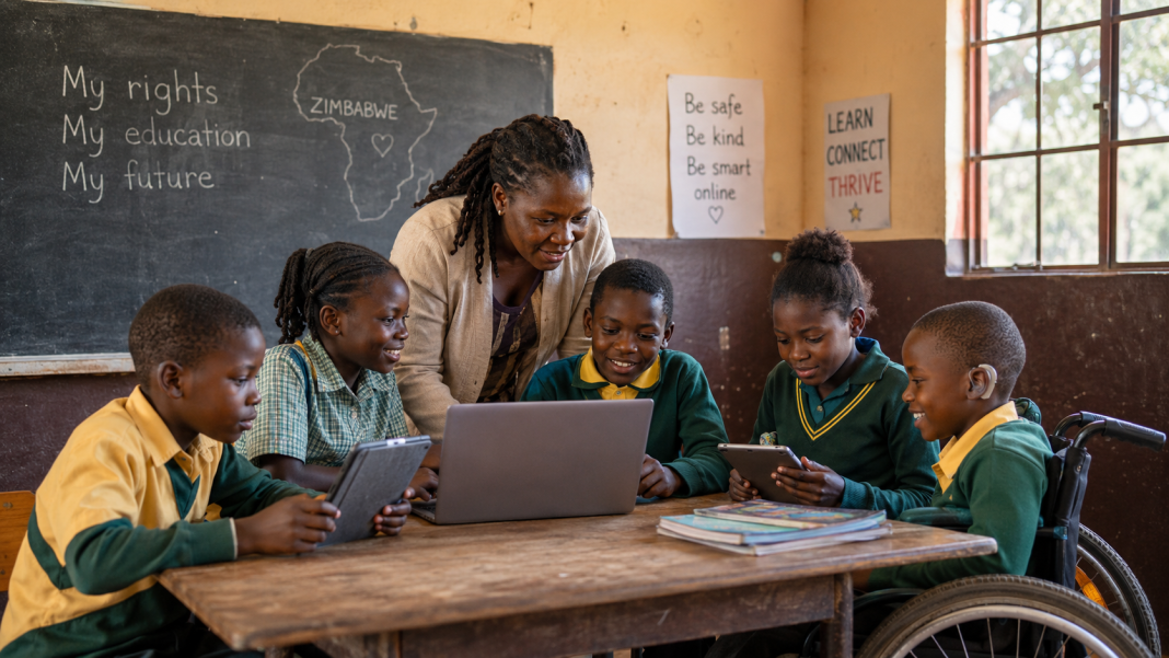 Zimbabwean schoolchildren using a laptop and tablets in a classroom as part of child-centred digital inclusion