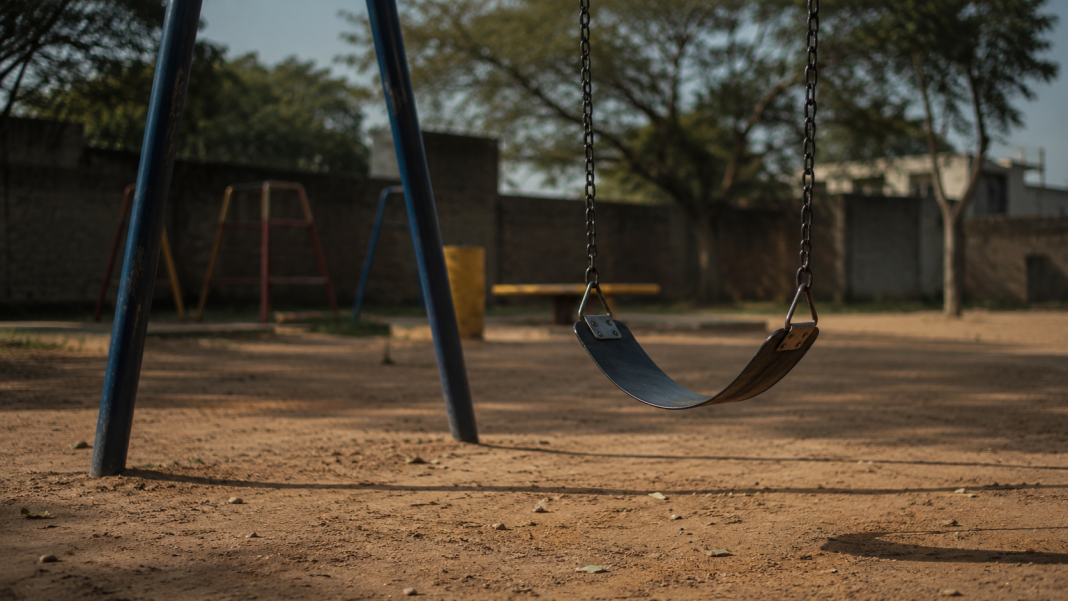 Empty playground swing symbolising child silence and safety concerns in the Kwekwe child abuse case.