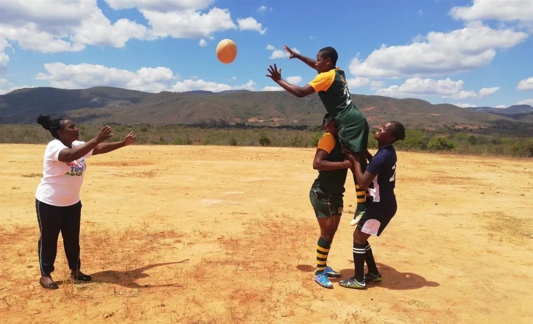 Pupils playing ball during a school sports activity in rural Zimbabwe