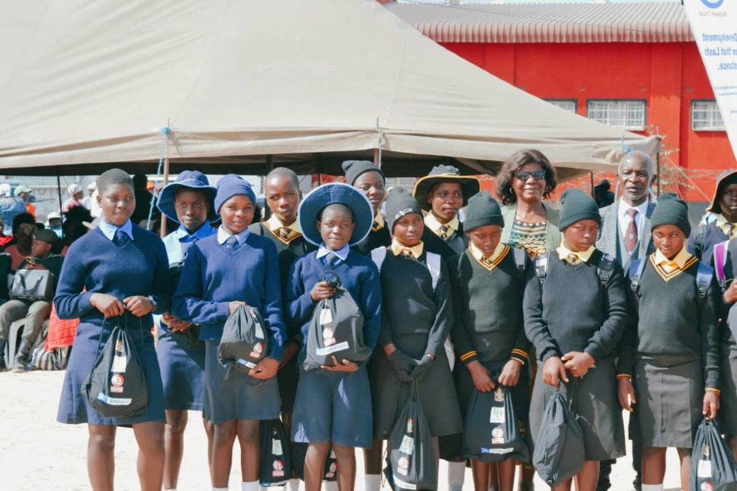 Schoolgirls hold dignity packs during World Menstrual Health Day commemorations in Murewa.