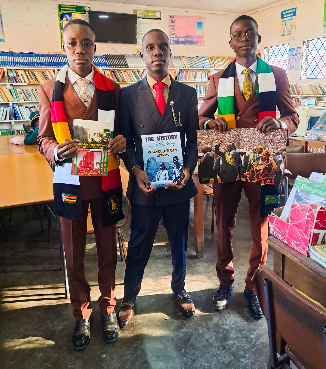 Young philanthropists hold textbooks donated to Zengeza 2 High School inside the school library.