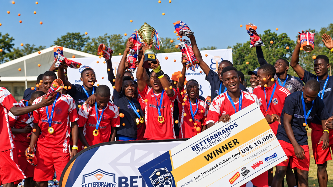 Allan Wilson players celebrate with the Better Brands U20 trophy and a US$10,000 winners’ cheque after defeating Rusununguko on penalties.